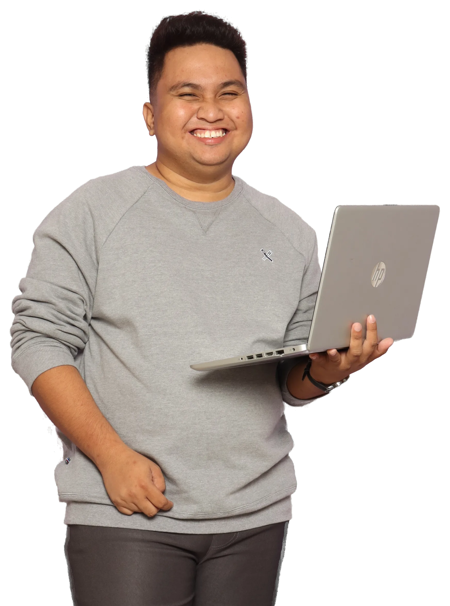 Joshua Ricafrente laughing, holding an open laptop.